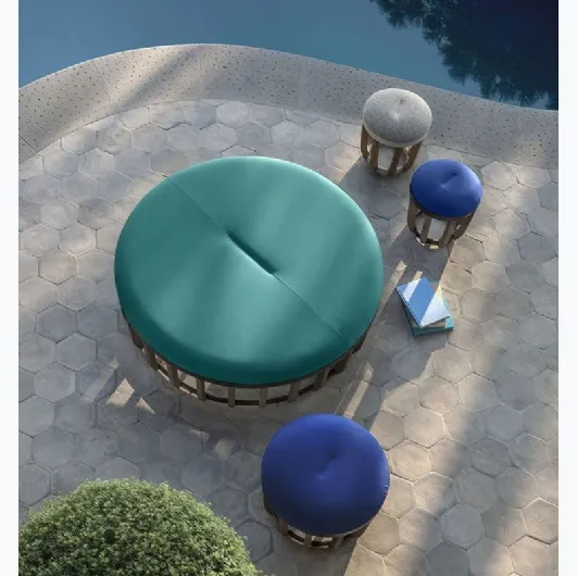 Swing fabric pouf with aluminum base by Ethimo.