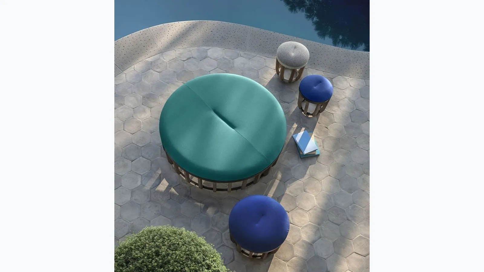 Swing fabric pouf with aluminum base by Ethimo.