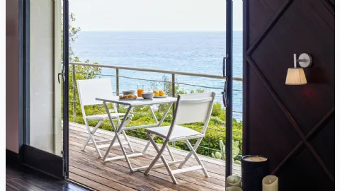 Aluminum and textilene chair with aluminum Queen table by Talenti.