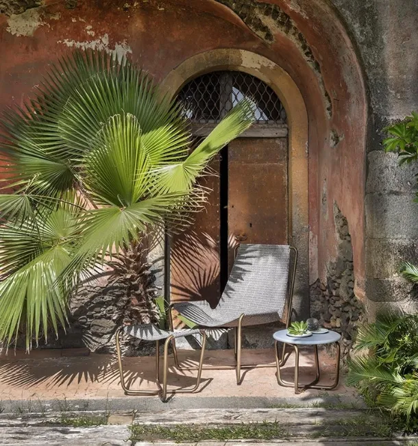 Sling Coffee Table with cement top by Ethimo.