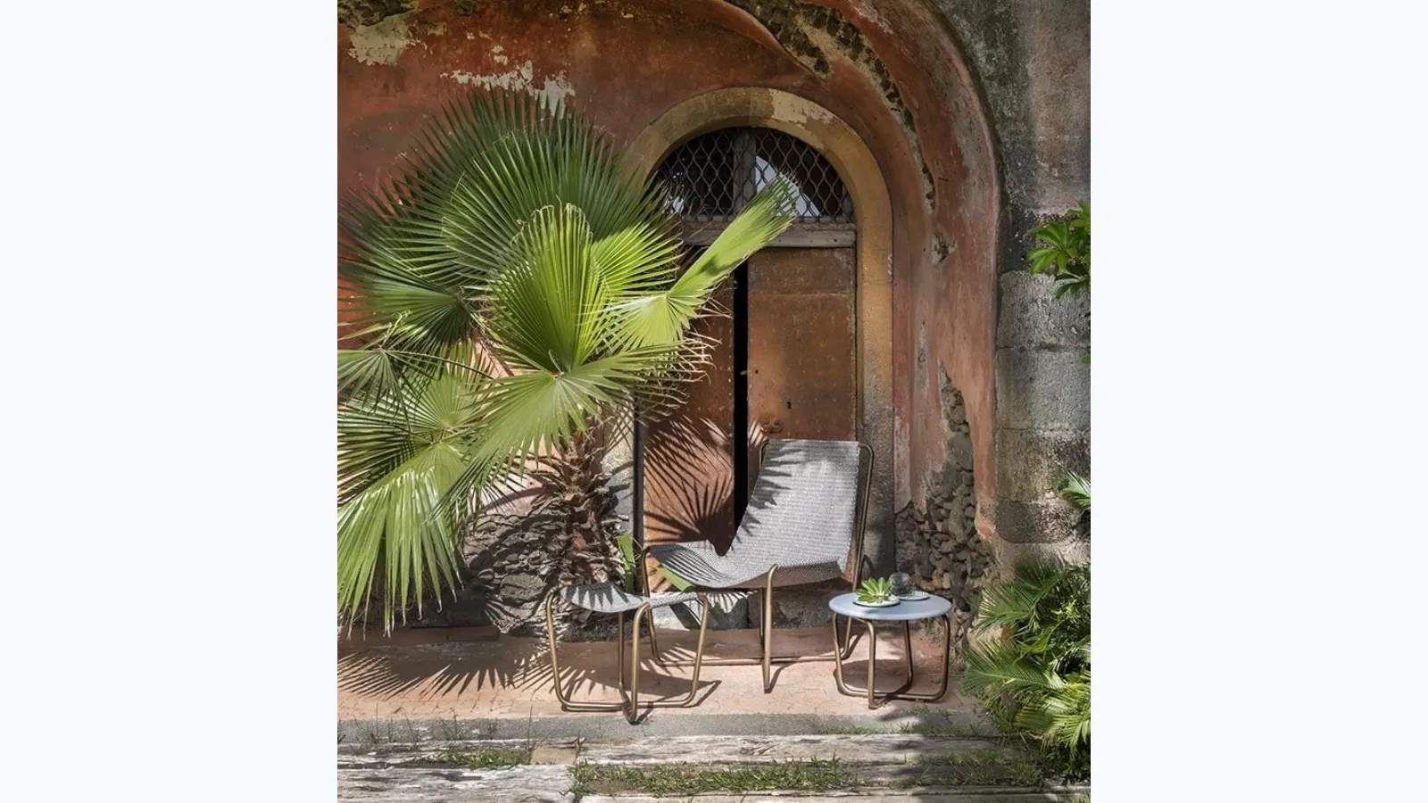Sling Coffee Table with cement top by Ethimo.