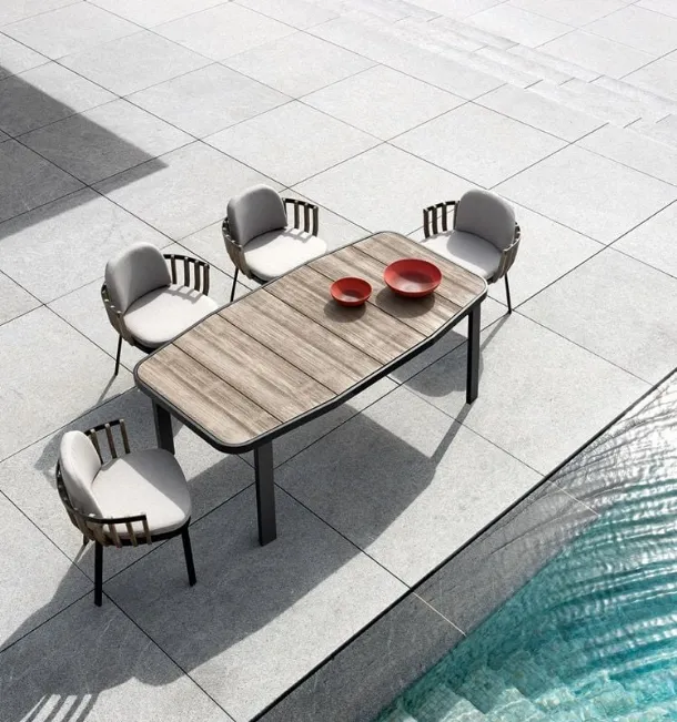 Swing armchair in teak and aluminum by Ethimo.