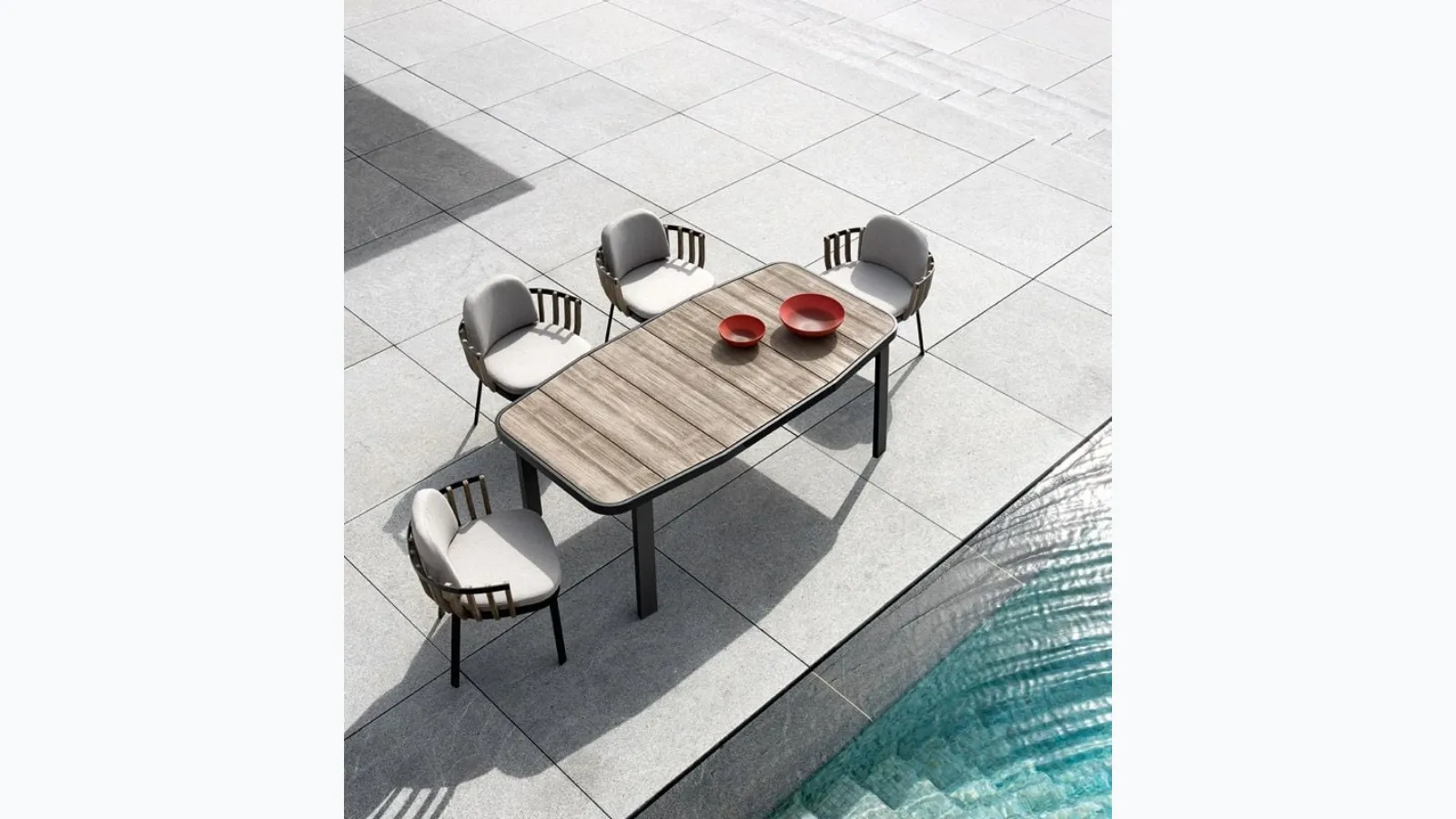 Swing armchair in teak and aluminum by Ethimo.
