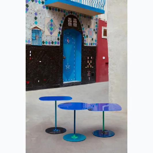 Thierry glass and metal tables by Kartell.