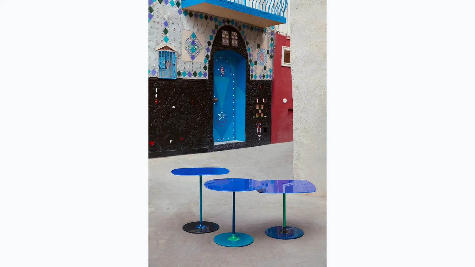 Thierry glass and metal tables by Kartell.