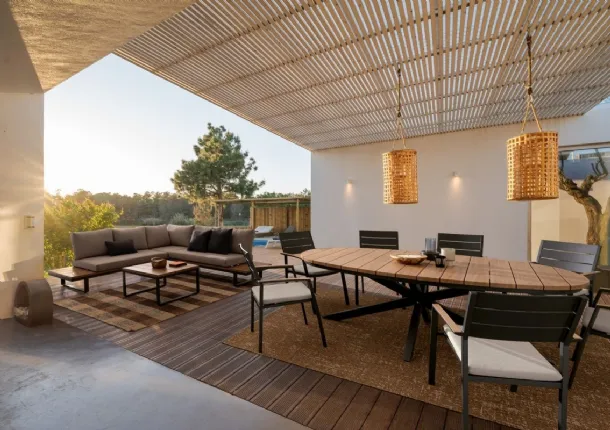 Table and Zelmar chairs in aluminum by Bizzotto.