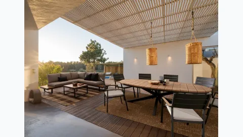 Table and Zelmar chairs in aluminum by Bizzotto.