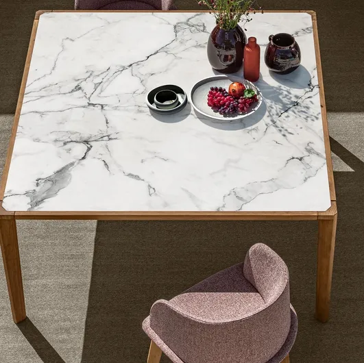 Table in stoneware and wood and chairs in fabric and wood CleoSoft Wood by Talenti.