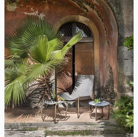 Sling Coffee Table with cement top by Ethimo.