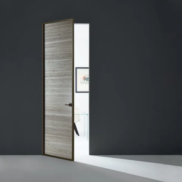 Sherazade Swing Plain interior door in glass with aluminum frame by Glas Italia.